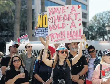  ?? Justin Sullivan Getty Images ?? A GROUP rallies at U.S. Sen. Dianne Feinstein’s office in L.A. State Democrats are trying to turn protests and meetings into lasting momentum. “People are hungry for ... ways to be helpful,” Rep. Scott Peters says.