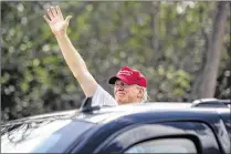 ?? MICHAEL ARES / THE PALM BEACH POST ?? President Donald Trump waves to his supporters on Southern Boulevard as his motorcade crosses the Bingham Island bridge in Palm Beach on Saturday.