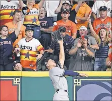  ?? [ERIC CHRISTIAN SMITH/THE ASSOCIATED PRESS] ?? The Yankees’ Aaron Judge catches a long fly ball hit by the Astros’ Yuli Gurriel on Saturday night in Houston.