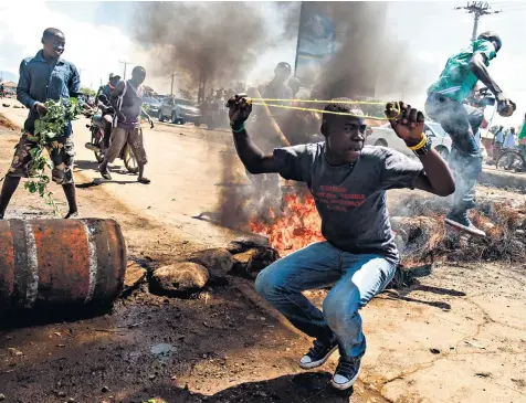  ??  ?? Supporters of Raila Odinga chant ‘October, no election’ as they demonstrat­e in the streets of Kisumu, Kenya. The election was expected to go ahead today