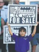  ?? Helen H. Richardson, Denver Post file ?? Jocelyn Campos, 7, holds up a sign on the steps of the Denver City and County Building on Sept. 19, 2016, during a press conference to address the lack of affordable housing in lower-income neighborho­ods.