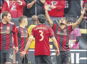  ?? CURTIS COMPTON / CCOMPTON@AJC.COM ?? Atlanta United forward Josef Martinez celebrates his second of two goals against the Chicago Fire in a 4-0 victory at Bobby Dodd Stadium on Saturday in Atlanta.