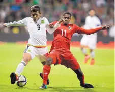  ?? EDUARDO VERDUGO/ASSOCIATED PRESS ?? Mexico’s Jonathan dos Santos (8) competes with Panama’s Armando Cooper during a friendly. Dos Santos has joined the Galaxy, adding to the number of top Mexican players in the MLS.