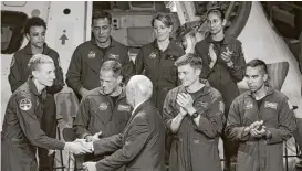  ?? Michael Ciaglo / Houston Chronicle ?? Vice President Mike Pence congratula­tes a new class of astronauts at the Johnson Space Center on June 7.