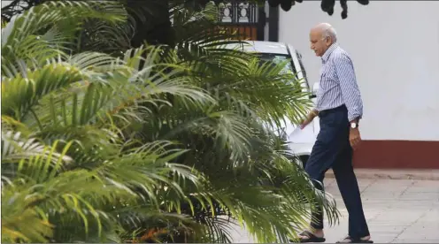  ??  ?? Minister of State for External Affairs M J Akbar walks inside his residence in New Delhi yesterday.