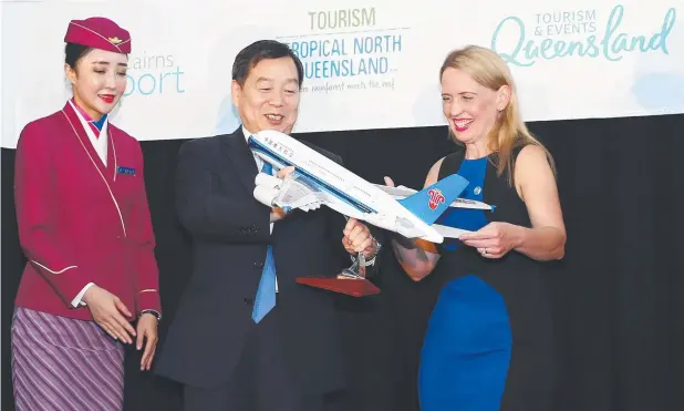  ?? Picture: BRENDAN RADKE ?? SMILES: China Southern Airlines assistant president Zhang Lin with State Tourism Minister Kate Jones. The airline marks one year of flying to Cairns.