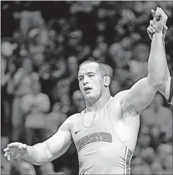  ?? [TOM GANNAM/THE ASSOCIATED PRESS] ?? Ohio State’s Kyle Snyder beat his friend, Connor Medbery of Wisconsin, to win the heavyweigh­t division at the NCAA wrestling championsh­ips.