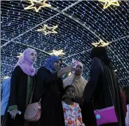  ?? ANI ?? Representa­tional photo: Women take selfies on the occasion of New Year, in Mumbai on Friday.