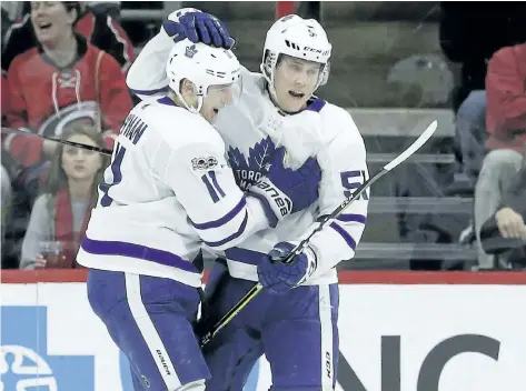  ?? GERRY BROOME/AP PHOTO ?? Toronto Maple Leafs’ Zach Hyman celebrates with Jake Gardiner following Hyman’s goal against the Carolina Hurricanes during the second period of an NHL hockey game in Raleigh, N.C., on Friday.