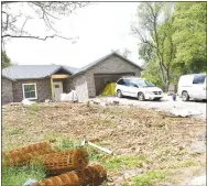  ?? Westside Eagle Observer/MIKE ECKELS ?? Constructi­on crews work on the interior of a new home on Peterson Avenue in Decatur on April 29.