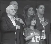  ?? SAM RICHE, TNS ?? U.S. Vice-President Mike Pence covers his heart along with his wife, Karen, during the national anthem in Inidanapol­is on Sunday. Pence left after the anthem because San Francisco 49er players protested.