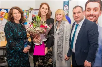  ?? ?? Katie Hannon receiving flowers after delivering an inspiring speech at the Listowel Campus: Miriam Goulding, Katie Hannon, Carmel Kelly (Clash Road Campus Deputy Principal) and Stephen Goulding (Clash Road, Denny Street and Listowel Campus Principal).