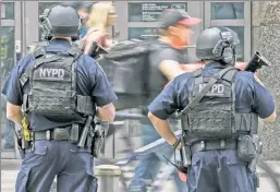  ??  ?? People-watching: Police across the US have been forced to the sidelines.