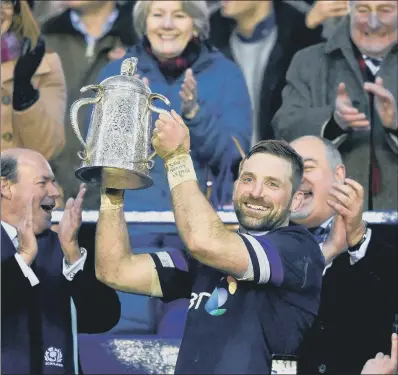  ?? PICTURE: IAN RUTHERFORD/PA WIRE ?? IT’S OURS: Scotland captain John Barclay holds up the Calcutta Cup after Scotland defeated England 25-13 on Saturday.