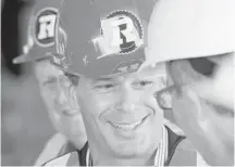  ??  ?? CFL commission­er Mark Cohon sports a REDBLACKS hard hat during a brief tour and ceremony to mark the completion of the concrete structure of the new south-side stands at Lansdowne Park.