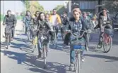  ?? AFP ?? Marina Jaber (centreleft) rides a bicycle with others in Baghdad on Thursday.