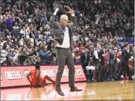  ?? Jessica Hill / Associated Press ?? UConn coach Dan Hurley leaps into the air to rally fans during the second half of Sunday’s game against Arizona at the XL Center in Hartford.