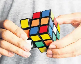 ?? CONTRIBUTE­D ?? What was the top toy in the 1980s? Believe it or not, the Rubiks cube was the must-have gift.