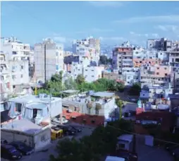  ??  ?? A view of the crowded Beirut neighbourh­ood that surrounds Shatila and Sabra camps and the adjacent “gatherings.”