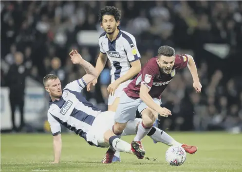  ??  ?? 0 Chris Brunt fouls Aston Villa’s John Mcginn. The West Brom midfielder was shown a second yellow card – then a red – for the tackle.