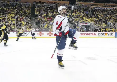  ?? KIRK IRWIN/GETTY IMAGES ?? Alex Ovechkin of the Washington Capitals celebrates after scoring the game-winning goal late in the third period of Game 3 in their series against the Pittsburgh Penguins on Tuesday.