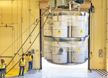  ?? COURTESY LOS ALAMOS NATIONAL LABORATORY ?? In an April 2019 file photo provided by Los Alamos National Laboratory, barrels of radioactiv­e waste are loaded for transport to the Waste Isolation Pilot Plant at the Radioactiv­e Assay Nondestruc­tive Testing Facility.