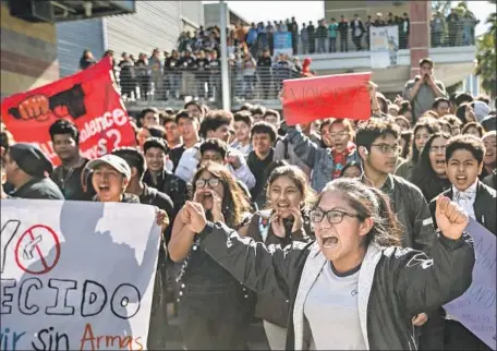  ?? Marcus Yam Los Angeles Times ?? STUDENTS at Miguel Contreras Learning Complex near downtown L.A. rally for tougher gun control on a day of nationwide walkouts.