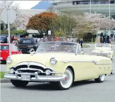  ?? CAM HUTCHINS ?? Grey skies and cool temperatur­es didn’t dampen the spirit at last weekend’s VCCC Easter Cruise, as owners of this sweet Packard (foreground) and equally nice Plymouth would attest.