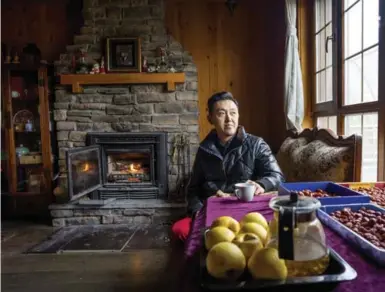  ?? SIM CHI YIN PHOTOS/THE NEW YORK TIMES ?? Qin You, who works in private equity, at his home he shares with his parents at Jackson Hole in Hebei province in China.