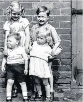 ??  ?? Pictured is what Brian believes are the Whitelaw family children with himself on the left (front row) in the back garden of either number one or three Moira Street.