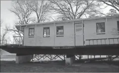  ?? Doug Walker / Rome News-Tribune ?? The Myra H currently sits on blocks at Mayo’s Bar Lock & Dam. Efforts are in the early stages to try to better preserve the boat and move it to a location where more people will be able to learn about its history.