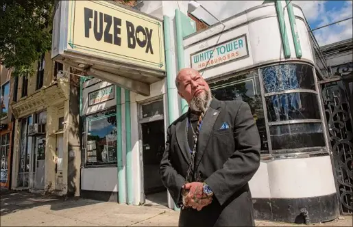  ?? Lori Van Buren / Times Union ?? Entreprene­ur William “Tragedy” Yager is the new owner of the Fuze Box building in Albany. Yager, who owns barbershop­s, tattoo parlors, a laundromat and mead bar, plans to to revitalize the site.