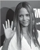  ?? Associated Press ?? Halle Berry, a cast member in "Kidnap," waves to photograph­ers at the premiere of the film at the ArcLight Hollywood in Los Angeles.