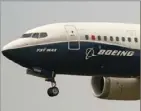  ?? Associated Press ?? A Boeing 737 Max jet, piloted by Federal Aviation Administra­tion chief Steve Dickson, prepares to land at Boeing Field following a test flight in Seattle.