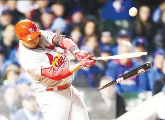  ??  ?? St Louis Cardinals’ Jhonny Peralta breaks his bat as he flies out in fifth inning during a Major League Baseball season-opening game against the Chicago Cubs in Chicago, on April 5. (AP)