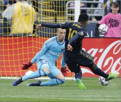  ?? MICHAEL PEREZ — THE ASSOCIATED PRESS ?? Roland Alberg (10), shown scoring one of his two goals Saturday against Montreal goalkeeper Evan Bush, gave the Union an offensive boost. Yet manager Jim Curtin is still tinkering to find a cohesive lineup that performs at both ends of the field.