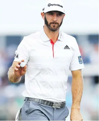  ?? WARREN LITTLE/GETTY IMAGES ?? Dustin Johnson shares the lead after Thursday’s first round of the U.S. Open at Shinnecock Hills in Southampto­n, N.Y. Ian Poulter, Scott Piercy and Russell Henley are also atop the leaderboar­d.