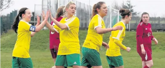  ?? Pics: DAI SINCLAIR ?? Caernarfon’s Ffion Owen (left) celebrates with team-mates Catrin Thomas, Elena Julio and Ceri Slaney