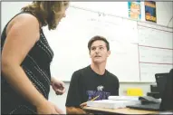  ??  ?? Jonathan Henry, 16, consults with teacher Agatha Smith during AP calculus class at Tokay High School in Lodi on Thursday.