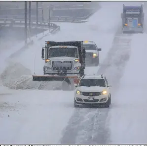  ?? (Arkansas Democrat-Gazette/Staton Breidentha­l) ?? A state Department of Transporta­tion snowplow clears the way Wednesday on westbound Interstate 30 in Little Rock as a second snowstorm socks the state. “We are plowing like crazy,” agency spokesman Dave Parker said, noting the many accidents occurring. More photos at arkansason­line/218snow/.