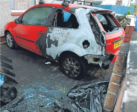  ??  ?? A CAR was completely destroyed in a deliberate fire on a residentia­l street.A Ford Fiesta parked in the driveway of a house in Craigmount Road in the Charleston area of the city was engulfed in flames after a fire in a wheelie bin spread at around 3am yesterday.