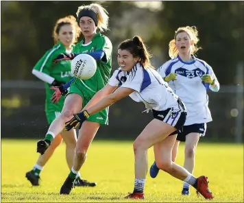  ??  ?? Kellie Kearney launching a Leinster attack despite the best efforts of Connacht’s Joanne Cregg in their inter-provincial clash in Kinnegad, Co. Westmeath, last November.