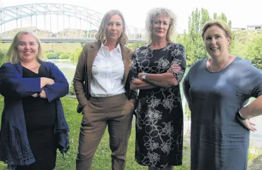  ?? PHOTO: PAM JONES ?? Women in power . . . Executive members of the Central Otago District Council (from left) chief adviser Dr Saskia Righarts, chief executive Sanchia Jacobs, planning and environmen­t executive manager Louise van der Voort and infrastruc­ture services executive manager Julie Muir stand beside the Alexandra bridge.