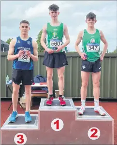  ?? ?? GOLD FOR SENAN - St. Colman’s College student Senan O’Reilly on top of the podium after winning gold in the 800 metres at the Munster Track and Field event in Tullamore.