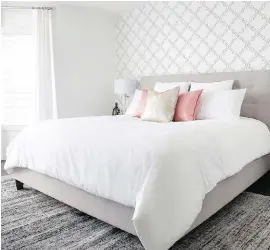  ??  ?? Designer Jenn MacDonald used a mix of design elements to update the master bedroom.