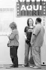  ?? BEN SKLAR/GETTY IMAGES ?? Voters wait outside a polling place held in a trailer at a grocery store parking lot in 2008 in Austin, Texas.