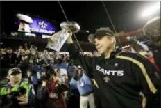  ?? THE ASSOCIATED PRESS ?? New Orleans coach Sean Payton holds the Vince Lombardi Trophy after the Saints defeated the Indianapol­is Colts, 3117, to win Super Bowl XLIV on Feb. 7, 2010.