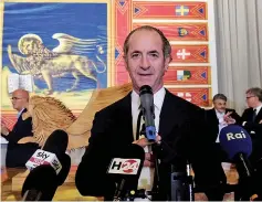  ?? — Reuters photo ?? Zaia speaks with journalist­s as he awaits the results of Veneto’s autonomy referendum in Venice.