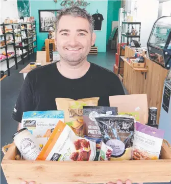  ?? Picture: GLENN HAMPSON ?? Brett Page, the owner of Vegan Aisle, is asking people to pay $100 for an annual membership so he can make healthy food cheaper.