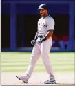  ?? Vaughn Ridley / Getty Images ?? Yankees outfielder Aaron Hicks celebrates a three-run double in the fourth inning against the Blue Jays at Rogers Centre in Toronto on Saturday.